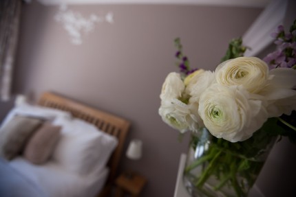 Fresh flowers in guest bedroom
