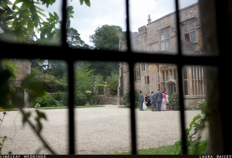 Guests are seen congregating outside Brympton House from the window of Castle House