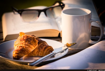 reading and croissant for breakfast