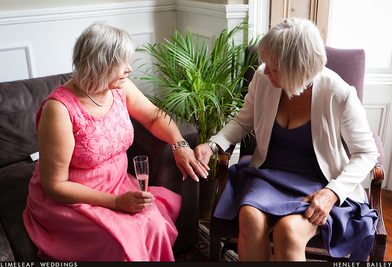 Mother of the bride and her sister chat and compare wedding rings