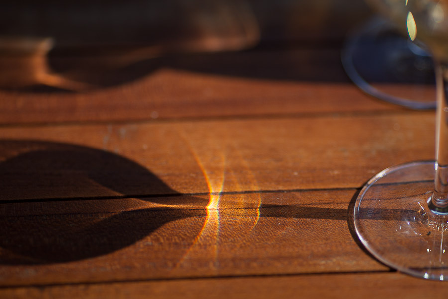 Wine glass refraction on table