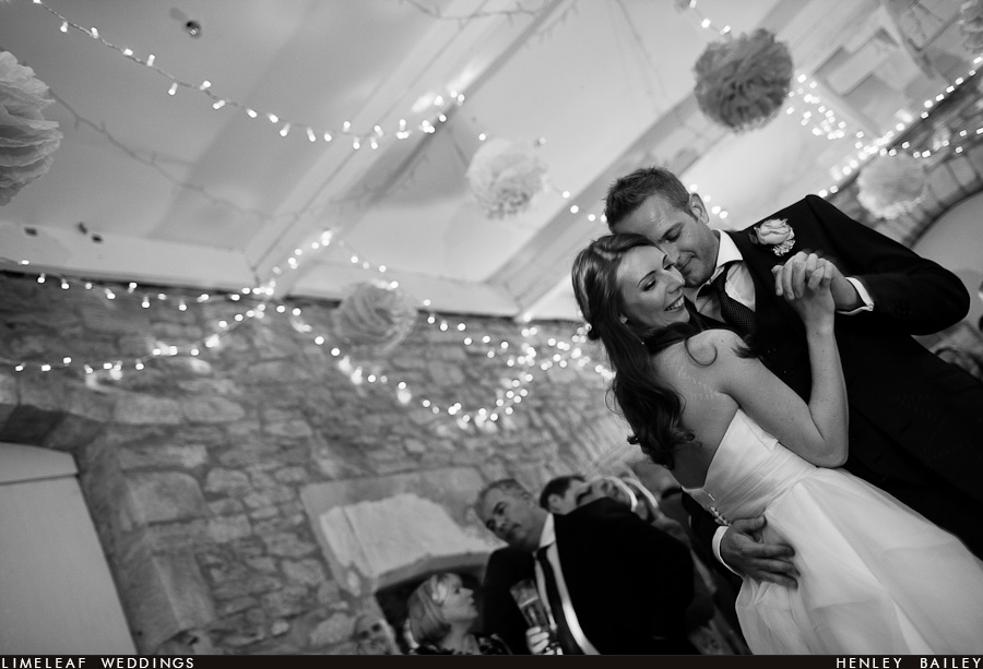 brympton-house-wedding-photography-120728-221517,_ Bride smiles as she does her first dance with her husband