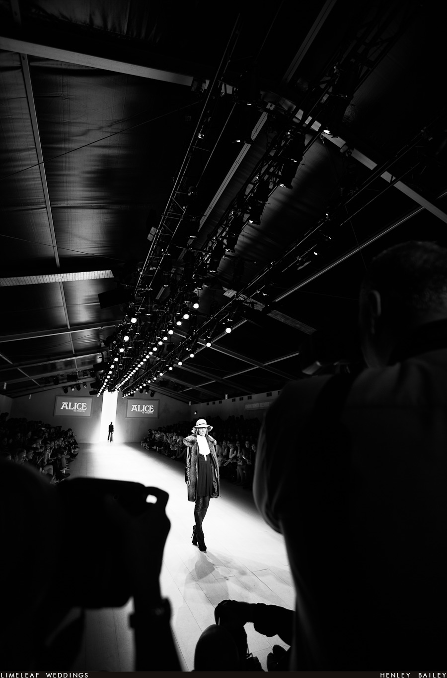 A model poses fro the photographers at LFW 2012
