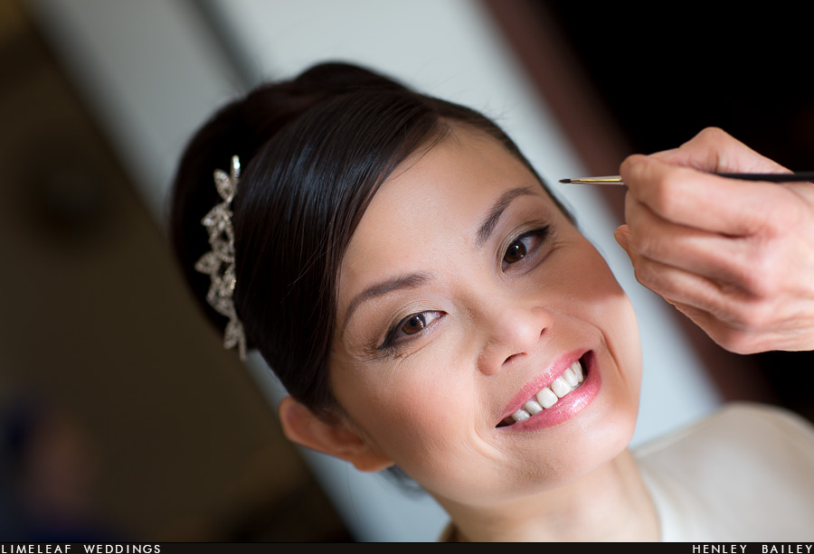 Ashley the bride smiling during makeup
